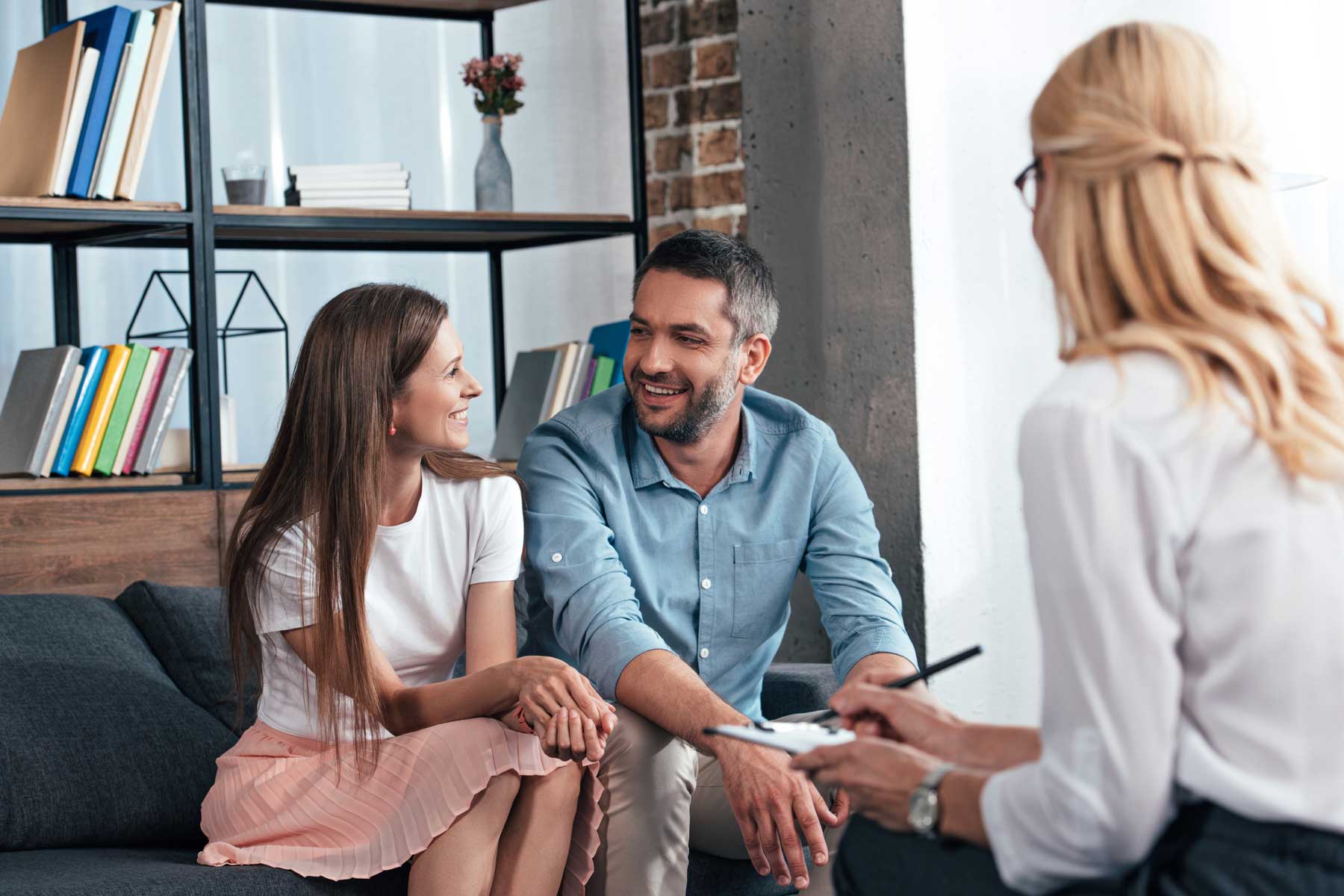 A married couple in session with a marriage counselor.